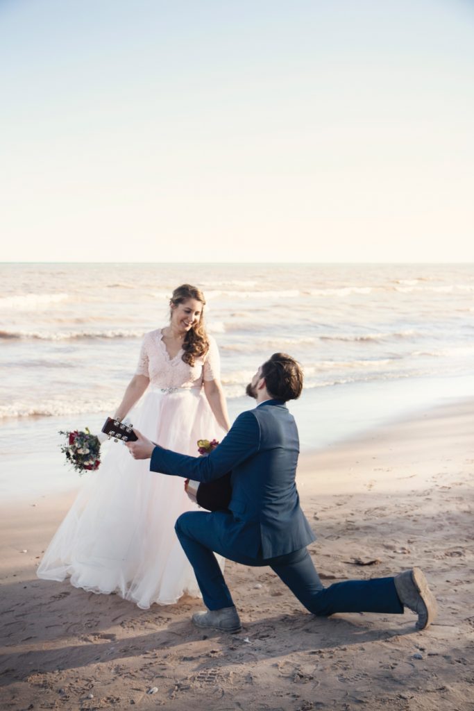 jen-theodore-8OAaIV_L2Q0-unsplash | Elope to Australia bride, groom, sand beach guitar