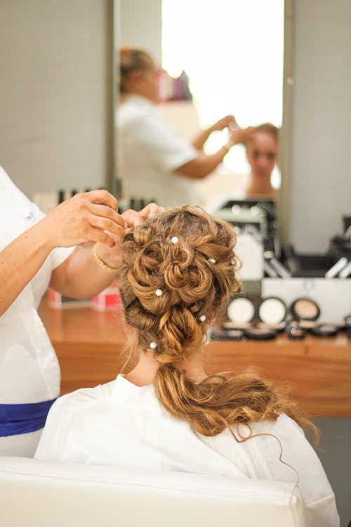 woman hairdresser wedding hair and makeup