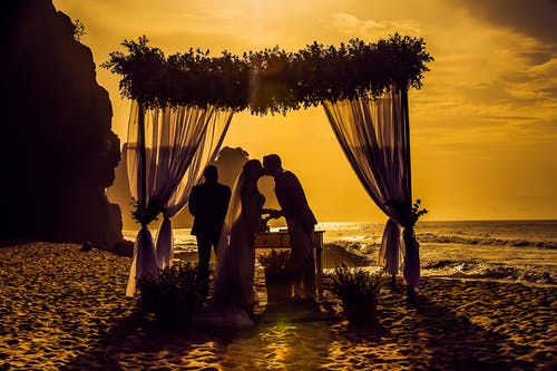 pexels-photo-2299698.png | Elope to Australia Arbour, bride and groom, floral arbour sand and ocean