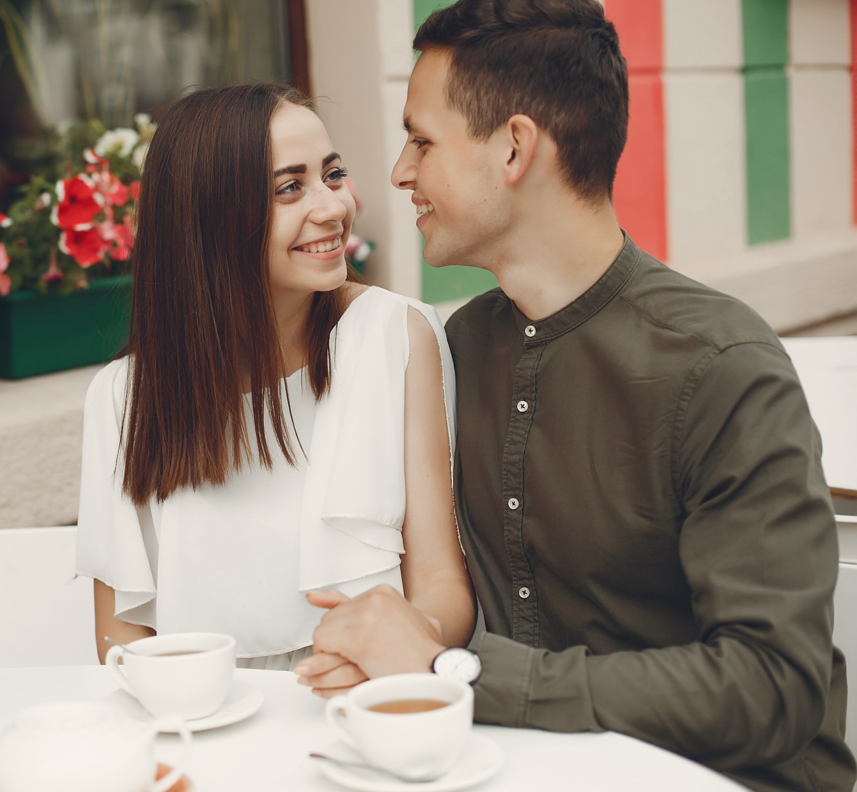 Beautiful couple spend time in a summer city